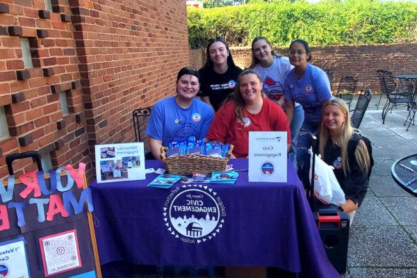Shenandoah University students run a table for the Center for Civic Engagement to promote campus engagement during the November 2022 elections